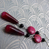 long pink earrings with black beads
