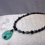 handcrafted semi-precious stone necklace with a pendant