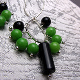 collection of green black semi-precious beads