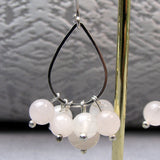 pink rose quartz beads clustered on silver hoop