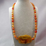 unique handcrafted orange statement necklace