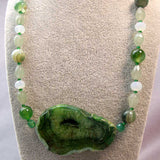 short green chunky bead necklace with a statement