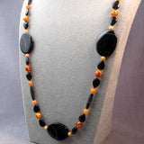 unusual handcrafted black orange long chunky statement necklace design