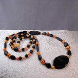 unusual long statement necklace black orange chunky beads