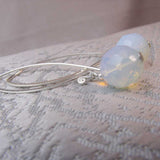 long drop bed earrings with a statement