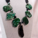unusual statement with big bold chunky green black beads