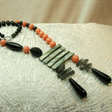 unusual handcrafted necklace with semi-precious beads and a statement