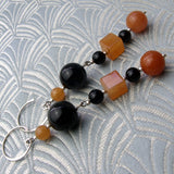 long handmade orange and black earrings uk