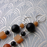 long orange black handmade statement earrings uk