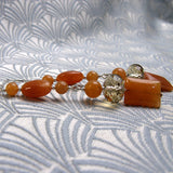 long orange statement earrings uk