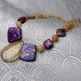 purple gold statement necklace chunky design