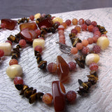 collection of brown semi-precious stone beads