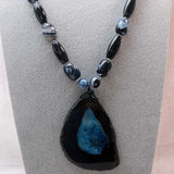 handcrafted long necklace with chunky blue black semi-precious beads