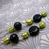 long drop green earrings with statement