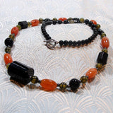 unique handmade black orange necklace design