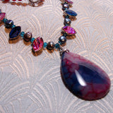 agate pendant on a necklace of semi-precious stones