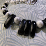 black onyx beads in a white gemstone necklace
