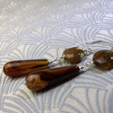 long brown gemstone earrings