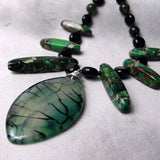green agate pendant on a semi-precious necklace
