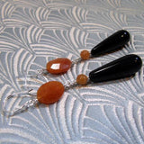 long orange black statement earrings
