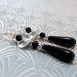 long black silver earrings with statement